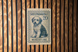 A miniature postage stamp featuring a dog, specifically a Sheepadoodle, with the text "SHEPADOOLE 20 MINIATURE" printed on it.