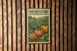 A vintage-style metal sign with the text "HEIRLOOM VEGETABLE GARDEN" displayed on a wooden wall.