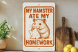 a humorous sign that reads "My hamster ate my homework" with an illustration of a hamster eating a piece of paper.