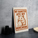a sign with a humorous message about a hamster eating homework.
