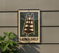 A sign with a ladder image is mounted on a wall, indicating a "Ladder Shelf" for storage or access.