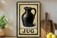 A vintage-style sign with a black and white illustration of a jug, placed on a wooden surface next to a wooden cutting board and a potted plant.
