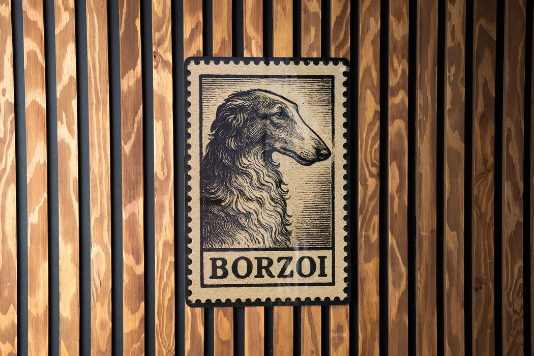 A vintage-style postage stamp featuring a dog's head is displayed on a wooden wall.
