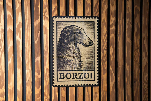 A vintage-style postage stamp featuring a dog's head is displayed on a wooden wall.