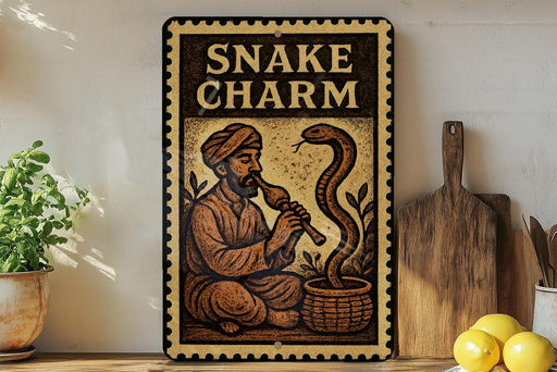a decorative sign with a man playing a musical instrument next to a large snake.