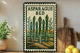 a decorative sign with a picture of asparagus on a wooden surface, accompanied by a wooden cutting board and a potted plant.