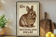 A 10 cent postage stamp from the Netherlands, featuring a detailed illustration of a rabbit, is displayed on a shelf next to a wooden cutting board and some lemons.