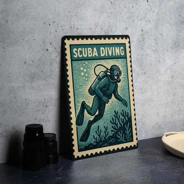 A metal sign with the word "SCUBA DIVING" printed on it, featuring an illustration of a scuba diver exploring underwater.