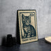 A metal stamp featuring a cat illustration, with the text "Tubby Kitten" printed on it.