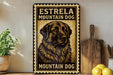 A vintage-style metal sign with a black and gold design, featuring a large illustration of a mountain dog. The sign is mounted on a wall and is surrounded by various kitchen items, such as a cutting board, a knife, and a bowl.