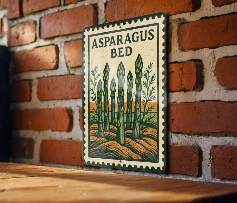 A metal sign with a picture of asparagus on a brick wall.