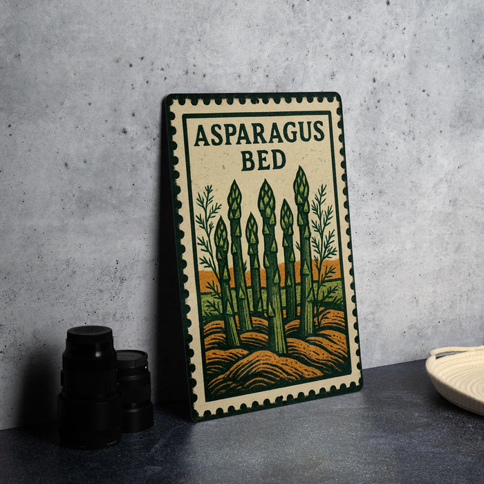 a metal sign with a design of asparagus on a wall, accompanied by a stack of black camera lenses and a white dish.