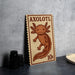 a wooden sign with an illustration of an axolotl, a type of salamander, and the text "AXOLOTL" printed on it.