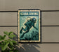 A metal sign with a scuba diver illustration, mounted on a wall next to a plant.