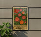 a sign for the Easter Cactus Garden, which is a postage stamp-like sign with a floral design and the text "Easter Cactus Garden" displayed on it.