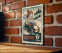 A vintage-style metal sign featuring a child riding a sled on a snowy hill, with the text "Sledding 6c" and a border.