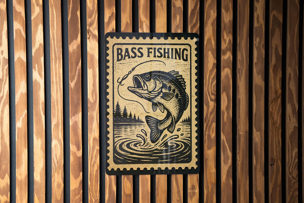 A sign with the text "BASS FISHING" and an illustration of a fish jumping out of the water, mounted on a wooden wall.