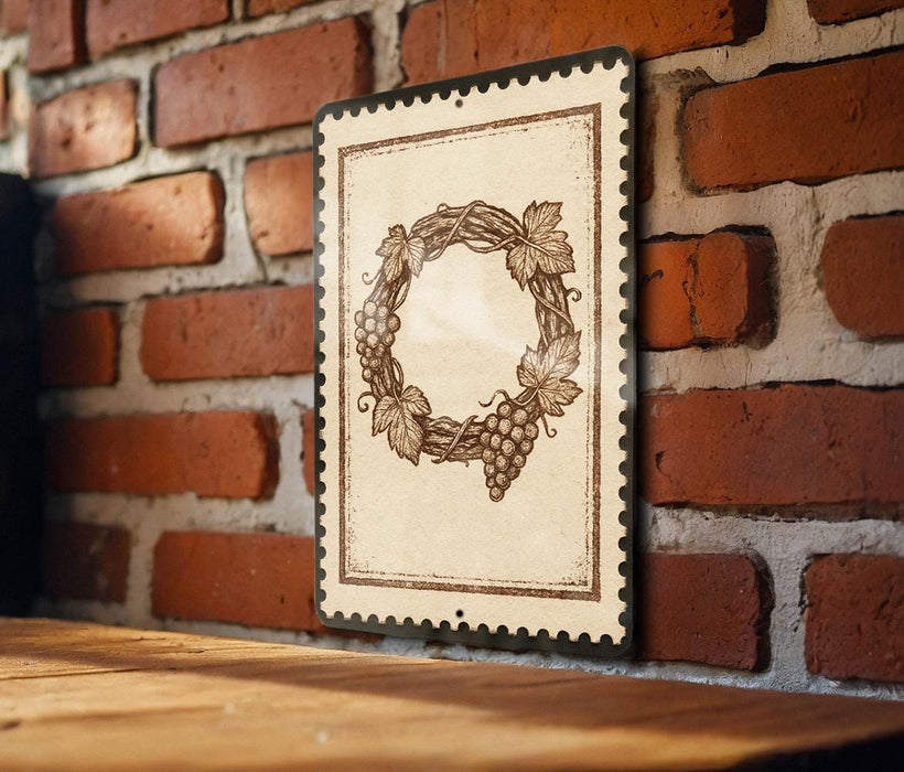 a decorative wreath with grapes hanging from it, mounted on a brick wall.