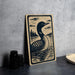 A wooden sign featuring a black and white illustration of a loon swimming in a lake, with a forest in the background.