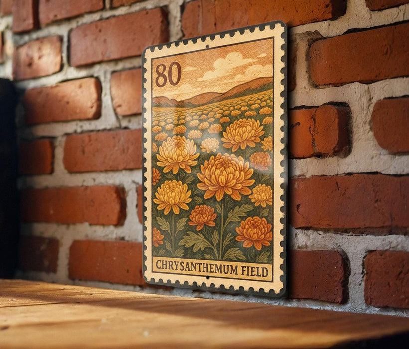 A metal stamp with a floral design is hanging on a brick wall.