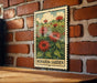 A metal sign with a floral illustration is mounted on a brick wall, displaying the text "MONARDA GARDEN".