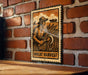 a vintage-style metal sign with a black and white illustration of a farmer harvesting wheat, mounted on a brick wall.