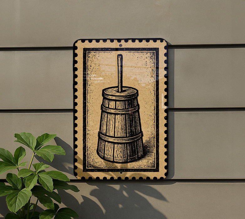 a wooden barrel with a handle, mounted on a wall.