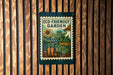 A sign for an eco-friendly garden, featuring illustrations of various plants and a sunflower.