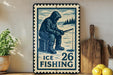 A vintage-style metal sign with a blue and white design depicting a person fishing, placed on a wooden surface next to a wooden cutting board and some lemons.