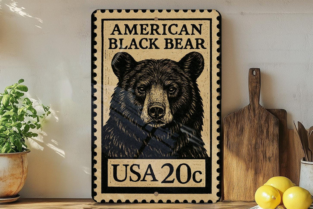 A framed image of a black bear on a wall, with a stamp-like border and text indicating it is an American black bear.