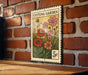 A vintage-style stamp or postcard with a floral illustration and the text "Cutting Garden" is displayed on a brick wall.