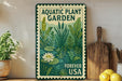 a vintage-style metal sign with a lush, green illustration of aquatic plants and a white water lily, placed on a wooden shelf next to a wooden cutting board and a potted plant.