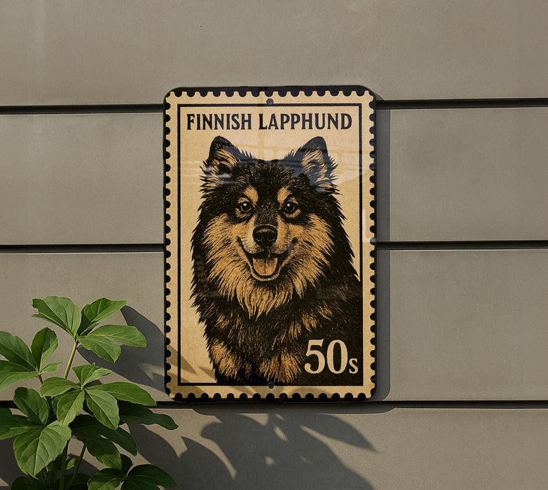 A wooden postcard featuring a picture of a Finnish Lapphund dog, with the text "FINISH LAPPHUND" and "50s" printed on it.