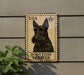 A metal sign featuring a black Scottish Terrier dog, mounted on a wall.