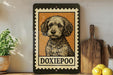 a framed illustration of a dog, specifically a Doxie poo, on a shelf.