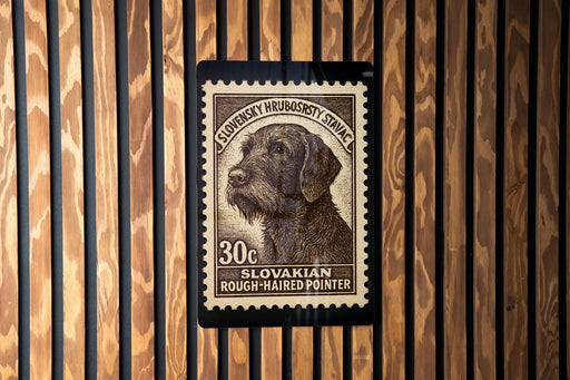 A stamp featuring a dog's head on a wooden background.