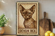 a framed stamp-like artwork depicting a Devon Rex cat, with the text "DEVON REX" below the image.