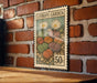 A vintage-style metal sign with a floral design hangs on a brick wall, displaying the text "LITHOPS GARDEN" and the price "50c".