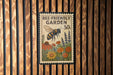 A poster or sign with a bee and flowers, mounted on a wooden wall.