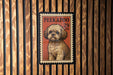 A framed image of a dog, likely a Shih Tzu, is displayed on a wooden wall.
