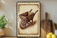 a wooden wheelbarrow with a decorative border, placed on a shelf next to a wooden cutting board and a potted plant.