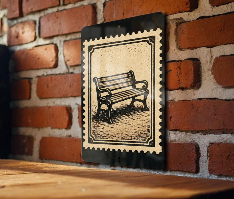 A black and white illustration of a bench is displayed on a brick wall, mounted on a wooden surface.