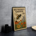 A metal sign with a bee and flowers, advertising a "Bee-Friendly Garden 50¢" on a gray wall.