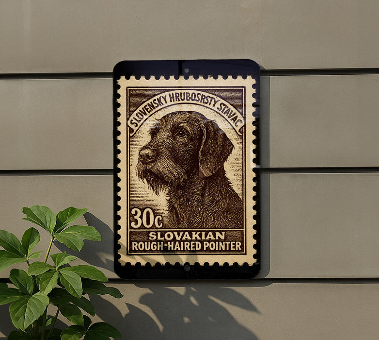 A stamp featuring a dog's head on a brown background, with text indicating it is a Slovakian Rough-haired Pointer.