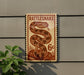 A vintage-style sign for a rattlesnake, featuring a large image of a rattlesnake and the text "Rattlesnake" and "6¢".