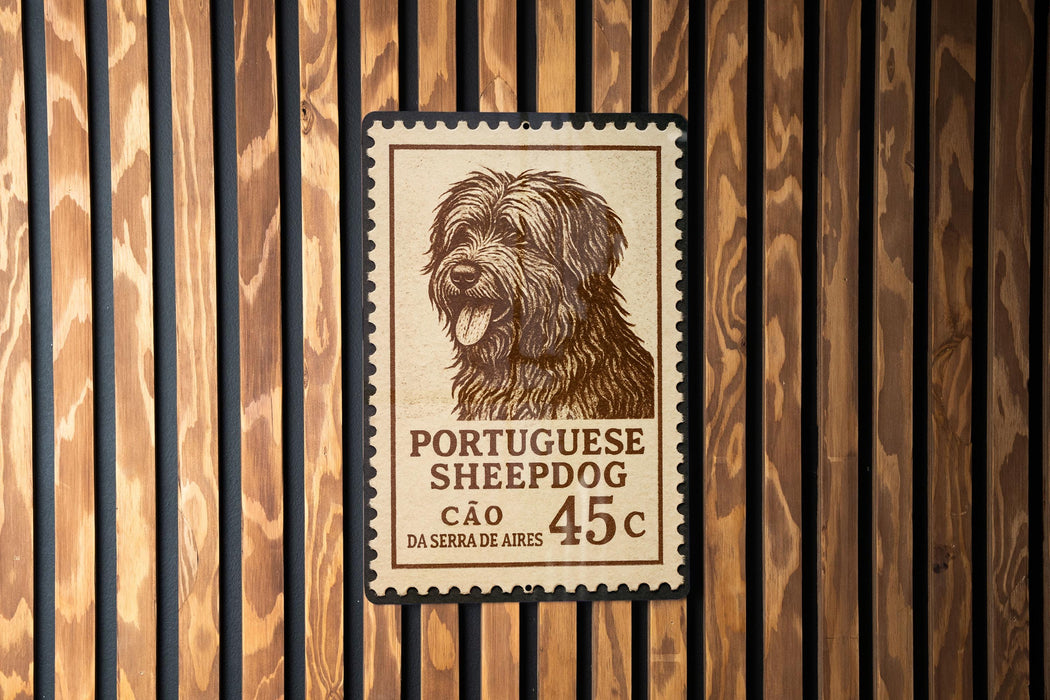 A Portuguese Sheepad dog stamp is displayed on a wooden wall.