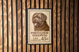 A Portuguese Sheepad dog stamp is displayed on a wooden wall.