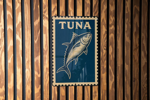 A blue sign with a fish illustration is mounted on a wooden wall.
