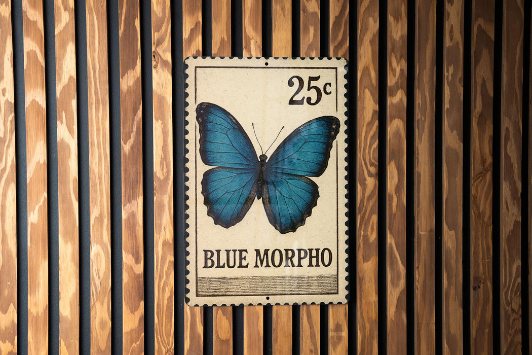 A 25c postage stamp featuring a blue butterfly is displayed on a wooden wall.