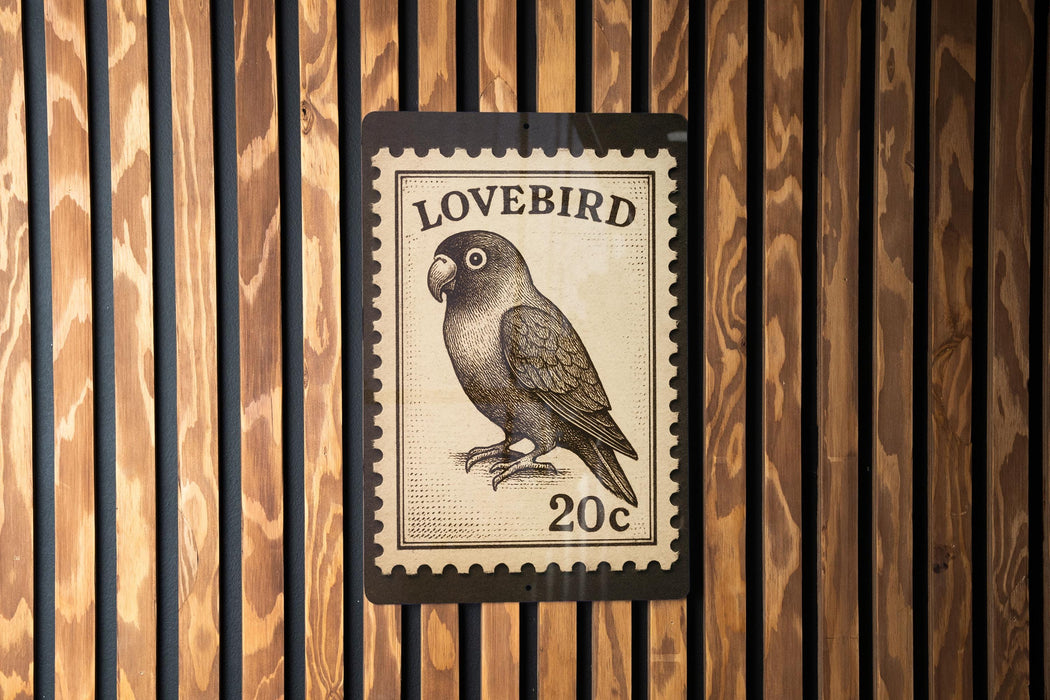 A postage stamp featuring a parrot is displayed on a wooden wall.